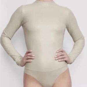 Two piece Skims faux leather body suit and matching biker shorts